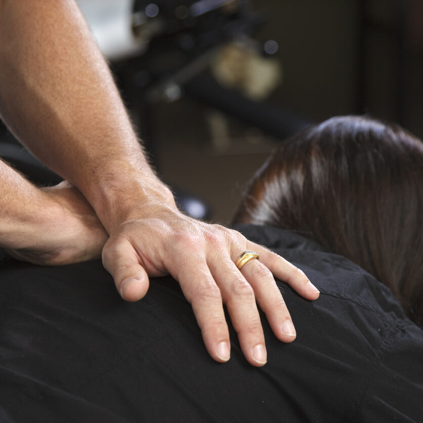 A patient receiving a treatment in a chiropractor office.